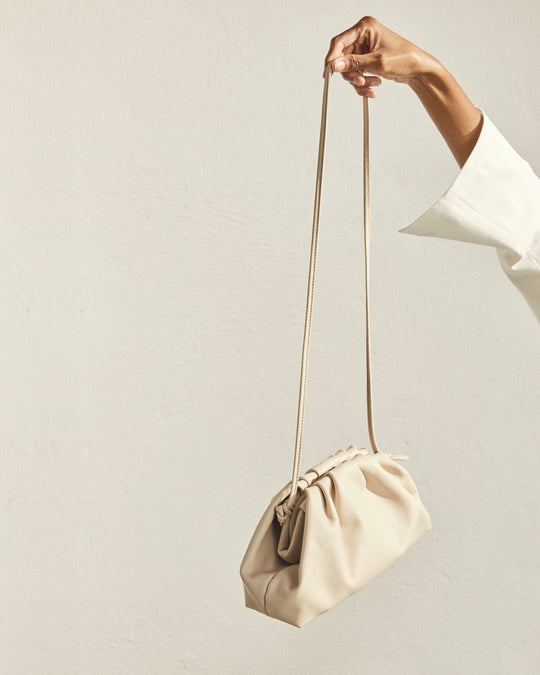 The D Cream Leather Clutch